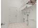 The laundry room contains shelving, tile floors, and a utility sink at 7512 Pon Kan, Punta Gorda, FL 33955