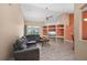 Bright and airy living room with neutral decor, a large sectional sofa, and an entertainment center at 7512 Pon Kan, Punta Gorda, FL 33955