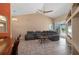 Spacious living room with vaulted ceilings and a large sectional sofa, perfect for relaxing and entertaining at 7512 Pon Kan, Punta Gorda, FL 33955