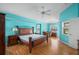 Bright primary suite with hardwood floors, large windows and desk area provides a cozy retreat at 7512 Pon Kan, Punta Gorda, FL 33955