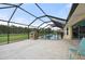 The screened pool and patio area offers lounge chairs, a playhouse, and privacy at 7512 Pon Kan, Punta Gorda, FL 33955