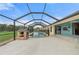 Backyard pool area enclosed with a screen and safety fence, plus a playhouse at 7512 Pon Kan, Punta Gorda, FL 33955