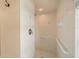 Walk-in shower with grab bars and tiled walls at 7512 Pon Kan, Punta Gorda, FL 33955