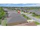 Drone view of home showing roof, yard with landscaping at 7652 Mikasa Dr, Punta Gorda, FL 33950