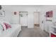 Bedroom with an open closet and a patriotic theme at 7652 Mikasa Dr, Punta Gorda, FL 33950