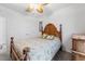 Bedroom featuring a bed with wood frame, a ceiling fan, and lots of natural light at 7652 Mikasa Dr, Punta Gorda, FL 33950