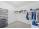 Spacious walk-in closet with wire shelving and ample storage space for clothing and accessories at 7652 Mikasa Dr, Punta Gorda, FL 33950