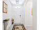 A front entry featuring a light tile floor and white walls at 7652 Mikasa Dr, Punta Gorda, FL 33950