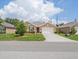 Charming single-story home featuring a well-manicured lawn, covered entry, and attached two-car garage at 7652 Mikasa Dr, Punta Gorda, FL 33950