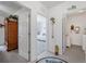 Bright hallway with natural light from the open doorway into the bedroom at 7652 Mikasa Dr, Punta Gorda, FL 33950