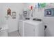 Neat laundry room with a washing machine and dryer at 7652 Mikasa Dr, Punta Gorda, FL 33950