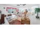 Bright living room featuring light color furniture, a ceiling fan, and decor with light color walls at 7652 Mikasa Dr, Punta Gorda, FL 33950