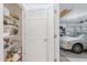 Pantry with lots of shelving; garage with car visible in background at 7652 Mikasa Dr, Punta Gorda, FL 33950