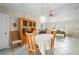 Bright dining area featuring a chandelier, display cabinet, and access to the living room at 891 Bayard St, Port Charlotte, FL 33948