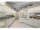 Spacious kitchen featuring white appliances, tile floors, and plenty of storage at 891 Bayard St, Port Charlotte, FL 33948