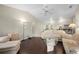 Spacious living room with hardwood floors, vaulted ceilings, a ceiling fan, and comfortable, inviting furniture at 891 Bayard St, Port Charlotte, FL 33948