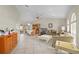 Bright and airy living room features tile floors, a dining table, comfortable seating, and sliding glass doors to the lanai at 891 Bayard St, Port Charlotte, FL 33948