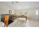Cozy living room with neutral decor, arched windows, and comfortable seating arrangement at 891 Bayard St, Port Charlotte, FL 33948