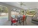 Inviting screened-in patio with seating area, perfect for relaxing near the sparkling pool and fenced backyard at 891 Bayard St, Port Charlotte, FL 33948