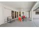 Comfortable screened patio with seating, views to backyard, and access to interior; great for entertaining guests at 891 Bayard St, Port Charlotte, FL 33948
