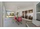 Spacious screened-in patio with outdoor seating and access to the backyard and a comfortable outdoor lounge at 891 Bayard St, Port Charlotte, FL 33948