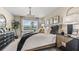 Bright, stylish bedroom featuring a large window view, modern decor, and a cozy, inviting atmosphere at 9710 Sand Dune Ln, Punta Gorda, FL 33950