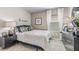 Well-appointed bedroom with modern furniture, a comfortable bed, and stylish decor at 9710 Sand Dune Ln, Punta Gorda, FL 33950
