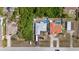 Aerial view of homes and lush greenery in a quiet residential neighborhood, complete with private backyard pools at 10229 Gulfstream Blvd, Englewood, FL 34224