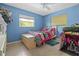 Bright bedroom with tiled floors, natural light and a comfortable bed at 10229 Gulfstream Blvd, Englewood, FL 34224