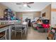 Dining area with a table, chairs, tile floor, storage shelving and a view of natural light at 10229 Gulfstream Blvd, Englewood, FL 34224