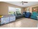 Bright living room with a large window and comfortable seating at 10229 Gulfstream Blvd, Englewood, FL 34224