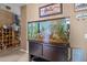 Inviting living space with a sizable fish tank at 10229 Gulfstream Blvd, Englewood, FL 34224