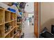 Long walk-in pantry with metal shelving and tile flooring, offering ample storage space at 10229 Gulfstream Blvd, Englewood, FL 34224