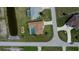 Bird's-eye view of home featuring a screened pool, beautiful landscaping, and canal access at 1 Sportsman Cir, Rotonda West, FL 33947