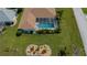 Aerial view of home with screened in pool in backyard and lovely landscaping at 1 Sportsman Cir, Rotonda West, FL 33947