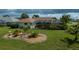 Well-maintained backyard with a screened-in lanai and decorative rock gardens, creating a relaxing outdoor retreat at 1 Sportsman Cir, Rotonda West, FL 33947
