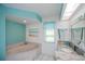Bathroom features a corner tub, granite vanity, and beach-themed decor at 1 Sportsman Cir, Rotonda West, FL 33947