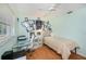 Cozy bedroom featuring light green walls, hardwood floors, and a comfortable bed at 1 Sportsman Cir, Rotonda West, FL 33947