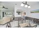 View of open concept dining room with views to living room, kitchen, and the backyard pool area at 1 Sportsman Cir, Rotonda West, FL 33947