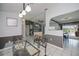 View of the open floor plan, with the dining room flowing into the living room and kitchen at 1 Sportsman Cir, Rotonda West, FL 33947
