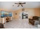 This spacious living room has modern furnishings, tile floors and provides kitchen access at 1 Sportsman Cir, Rotonda West, FL 33947