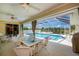Relaxing outdoor patio with comfortable seating and a view of the inviting screened-in pool at 1 Sportsman Cir, Rotonda West, FL 33947