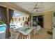 Charming outdoor patio with comfortable seating, ideal for entertaining and enjoying the poolside view at 1 Sportsman Cir, Rotonda West, FL 33947