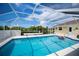 Sparkling screened-in pool with ample space for relaxation and fun in the sun at 1 Sportsman Cir, Rotonda West, FL 33947