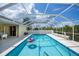 Inviting screened-in pool offers a refreshing escape with clear blue water and ample space at 1 Sportsman Cir, Rotonda West, FL 33947