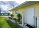 Charming side yard with decorative stone landscaping, adding curb appeal and visual interest to the property at 1 Sportsman Cir, Rotonda West, FL 33947