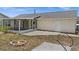 An open backyard with a seating arrangement, patio, and adjacent home at 10133 Gulfstream Blvd, Englewood, FL 34224