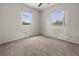 Bedroom with two windows offers natural light and neutral tones at 10133 Gulfstream Blvd, Englewood, FL 34224