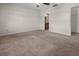 Spacious bedroom featuring plush carpet, ceiling fan and ensuite bathroom at 10133 Gulfstream Blvd, Englewood, FL 34224