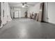 Large garage featuring a ceiling fan, and extra storage space at 10133 Gulfstream Blvd, Englewood, FL 34224